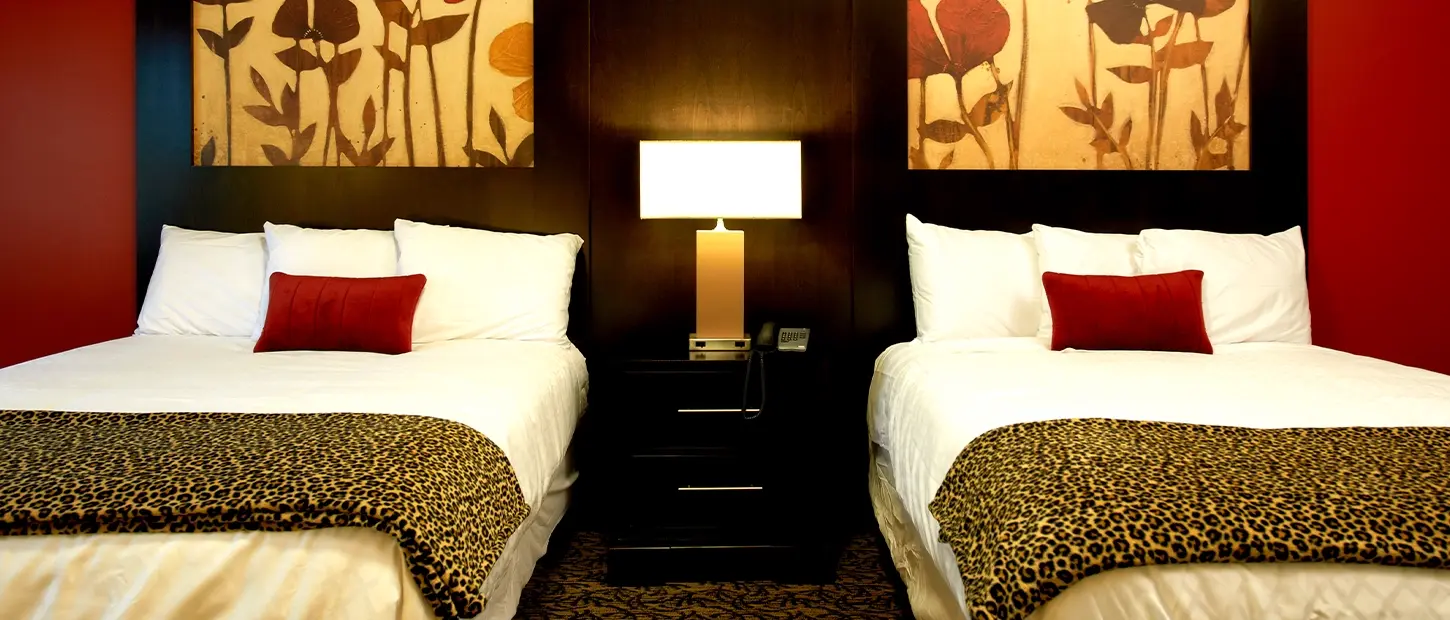 Two double beds in a guest room